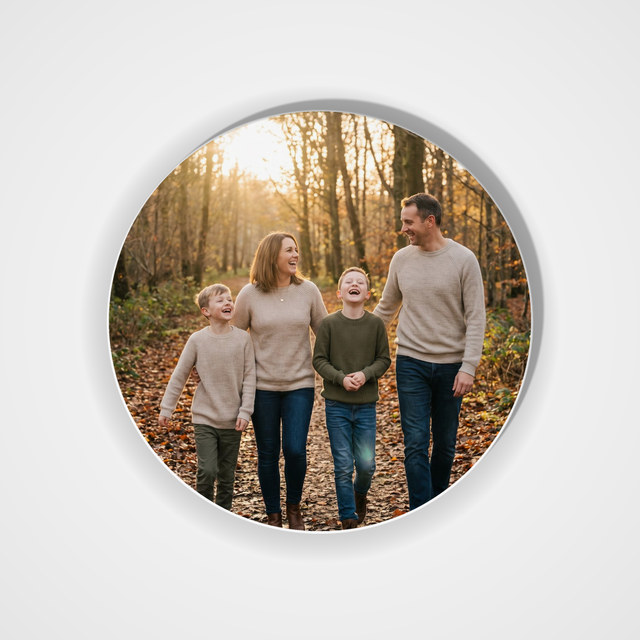 Porcelain ornament, round, 2.75 in with a family photo printed on it